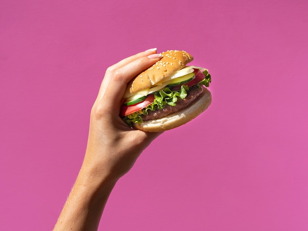 American burger with lettuce on pink background Photo | Free Download