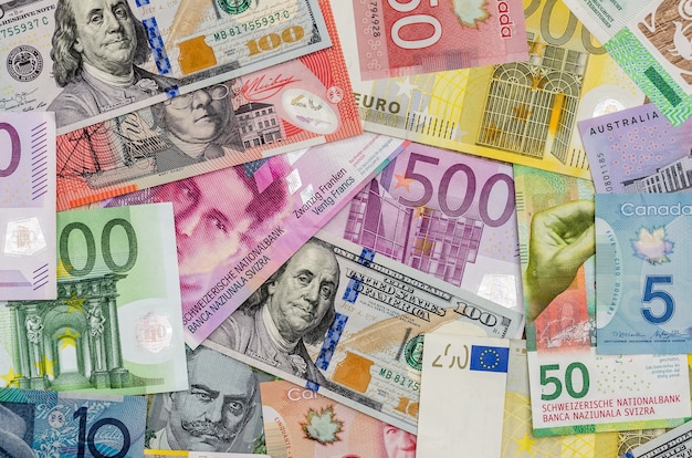 | American dollars, european euro, swiss canadian dollar, australian dollar bills