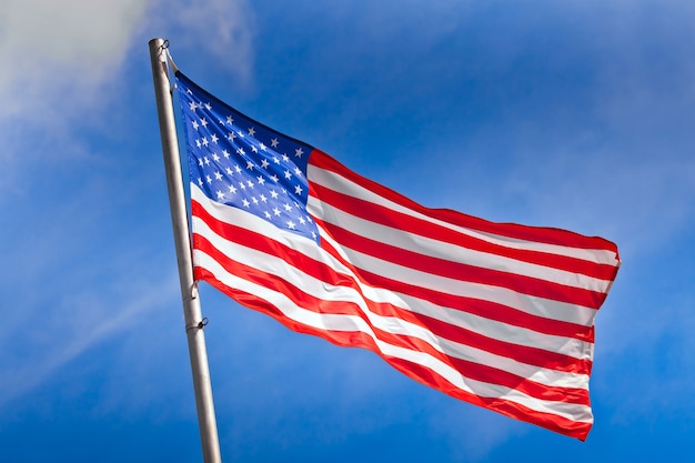 Premium Photo | American flag waving against the blue sky