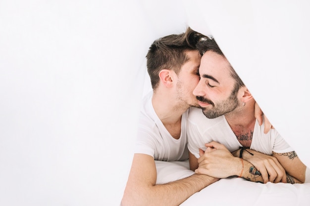 https://image.freepik.com/free-photo/amorous-gay-couple-cuddling-in-bed_23-2147743606.jpg