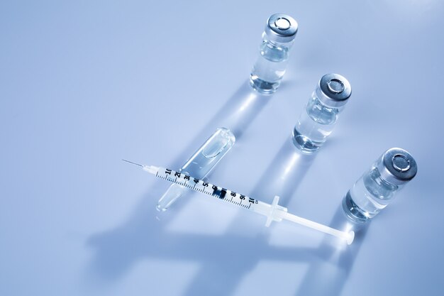 Premium Photo | Ampoules, vials, syringe. medical injection,diseases ...