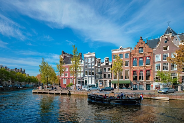 Premium Photo | Amsterdam view canal with boad bridge and old houses