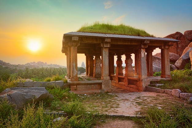 Ancient ruins in hampi on sunset. india Premium Photo