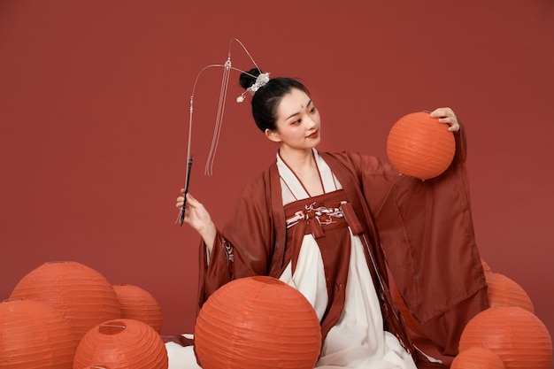 Ancient style hanfu beauty with red lantern writing Premium Photo