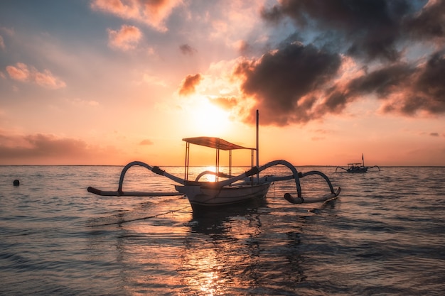 Premium Photo Ancient Traditional Jukung Fishing Boat On Seashore At