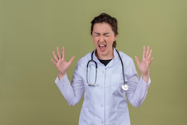Free Photo | Angry young doctor wearing medical gown wearing ...