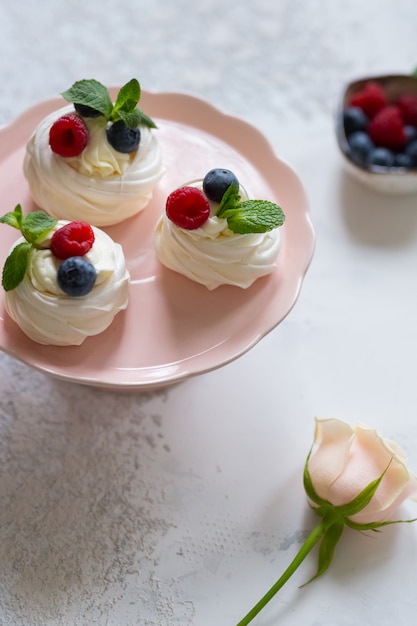 Premium Photo | Anna pavlova dessert with fresh berries. meringue. food ...