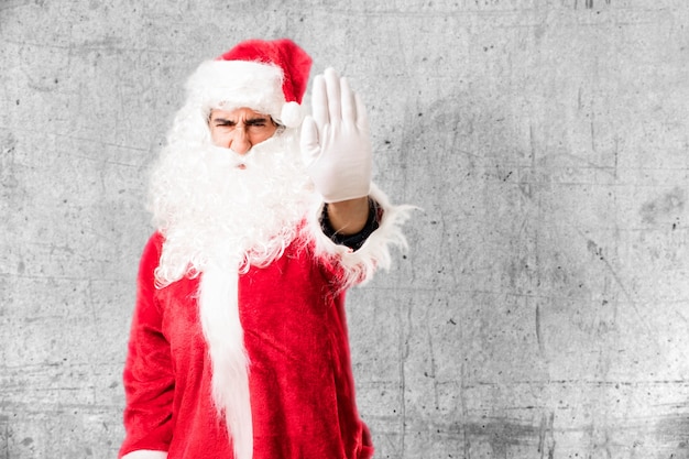 Download Free Photo | Annoyed man wearing santa claus costume