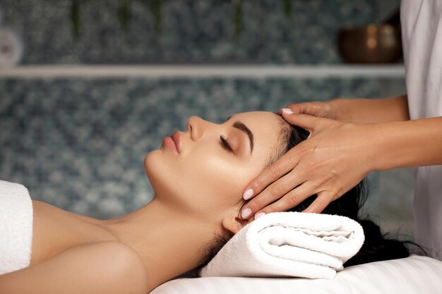 Premium Photo Anti Aging Facial Massage Woman Receiving Massage From Masseur At Spa Salon 