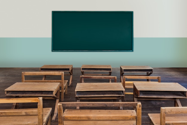 Antique-classroom-in-school-with-rows-of-empty-wooden-...