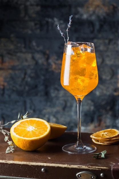 Premium Photo | Aperol spritz cocktail in glass on dark background