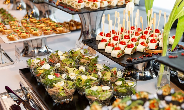 Premium Photo | Appetizing snacks on the buffet table at the event ...