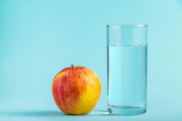 Download Free Apple And Glass Of Pure Water On A Blue Space Health And Diet Use our free logo maker to create a logo and build your brand. Put your logo on business cards, promotional products, or your website for brand visibility.