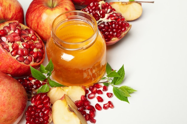 Premium Photo | Apple, pomegranate and honey on white, close up. home ...