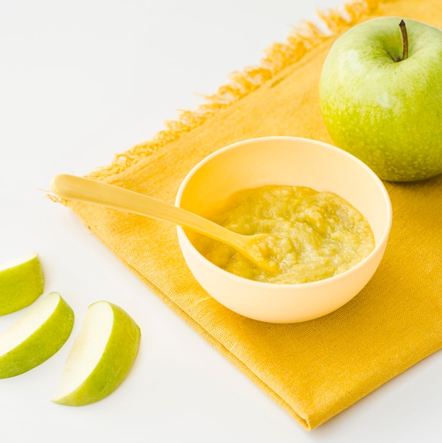 Free Photo Apple puree for baby on table