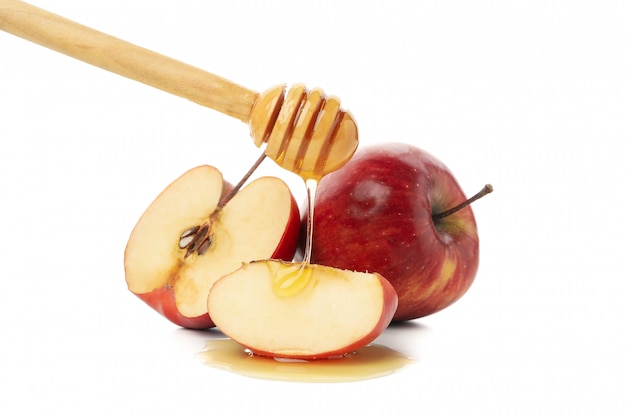 Premium Photo | Apples, honey and dipper isolated on white