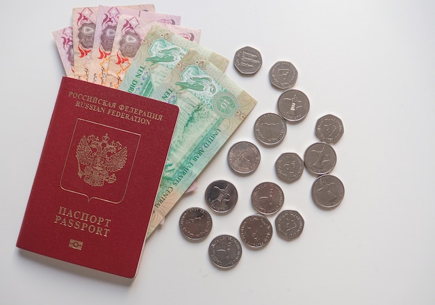 Download Free Arab Dirhams And A Russian Passport On White Background Premium Use our free logo maker to create a logo and build your brand. Put your logo on business cards, promotional products, or your website for brand visibility.