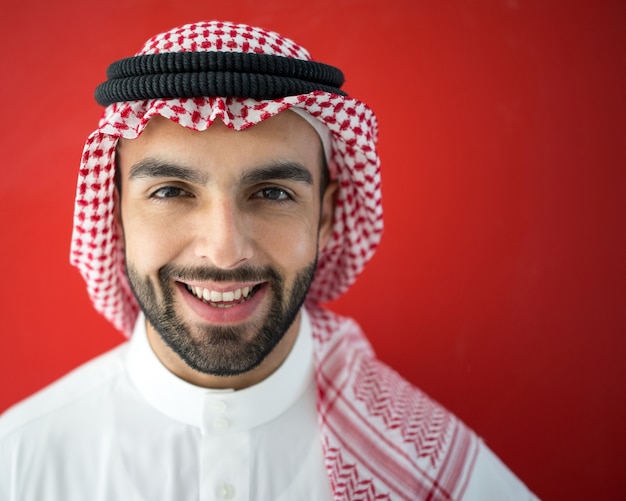 Arab man on red background Photo | Premium Download