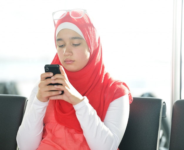 Arabic Middle Eastern Teenage Girl Using Cell Phone For Messag