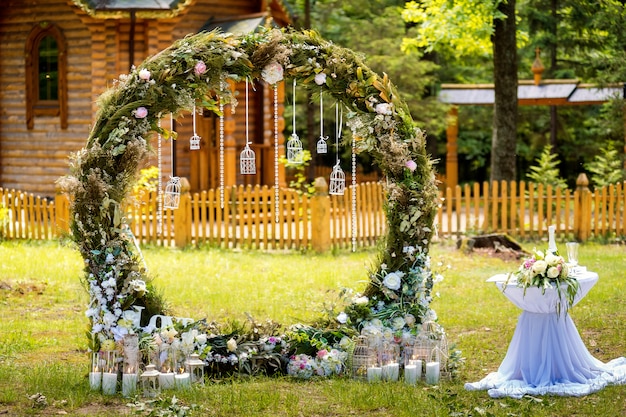 Arch For The Wedding Ceremony Decorated With Fabric Flowers And