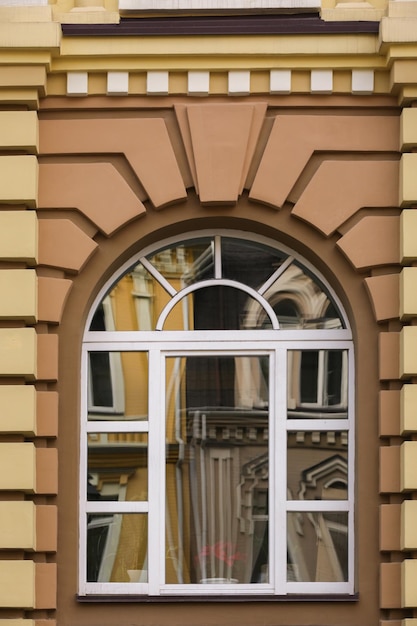 Premium Photo | Arched window with decorated wall background