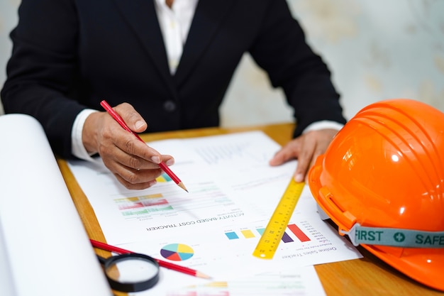 Architect or engineer working project with tools in office Premium Photo
