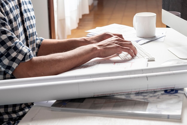 Architect looking at his project on his desk Free Photo