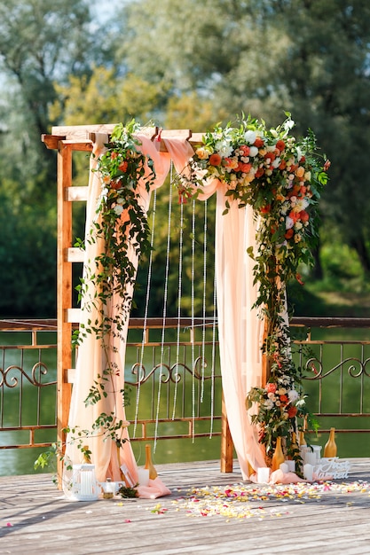 Premium Photo | Area of the wedding ceremony near river on the pier