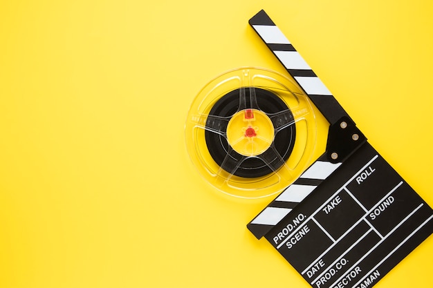 Premium Photo | Arrangement of cinema elements on yellow background ...