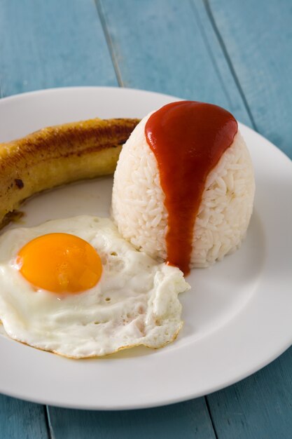 Premium Photo | Arroz a la cubana typical cuban rice with fried banana ...