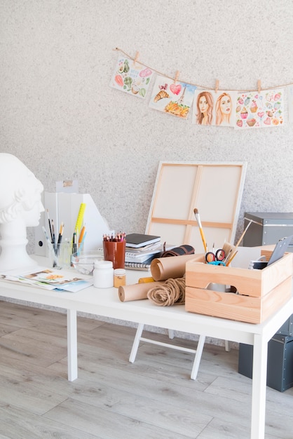 Free Photo | Art desk concept with painting supplies