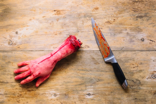 Free Photo Artificial Cut Hand In Blood And Knife