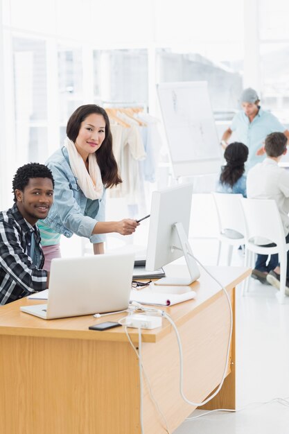 Artists Working At Desks In Creative Office Premium Photo