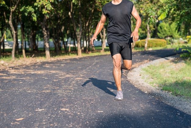 Premium Photo | Asia young man running in the time during sunrise on ...