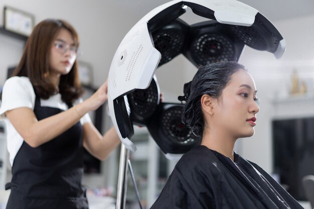 Asian beauticians are dyeing hair and doing hair for customers ...