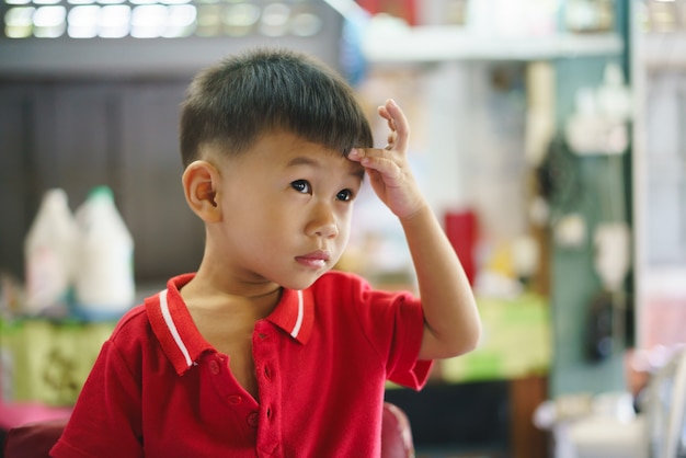 Asian Boy Getting Hair Cut By Barber Premium Photo