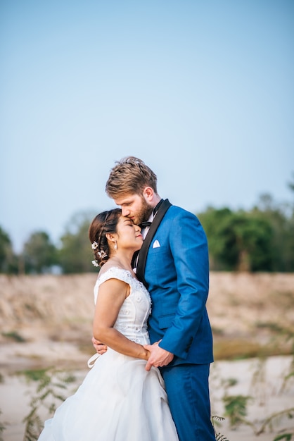 Asian bride and caucasian groom have romance time and happy together Free Photo