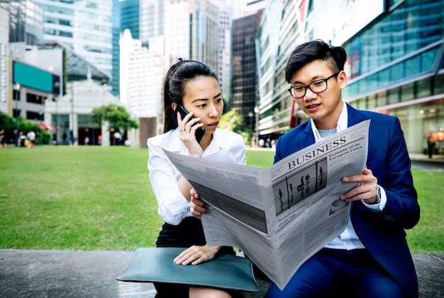 Free Photo | Asian business people reading the newspaper