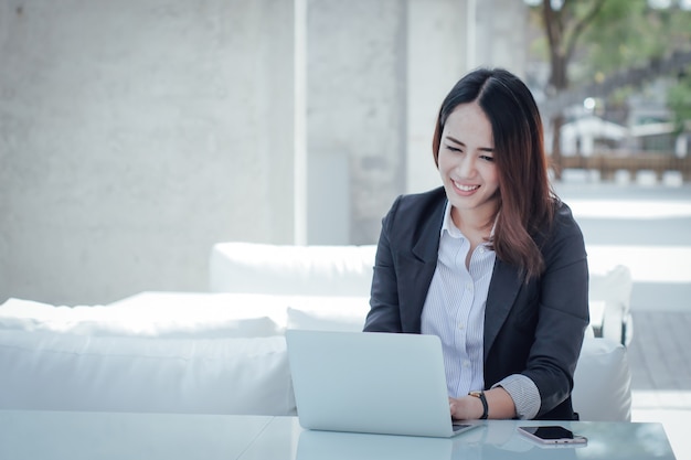 Premium Photo | Asian business woman with laptop happy and smile concept  success work