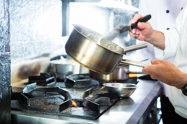 Premium Photo | Asian chefs cooking in restaurant