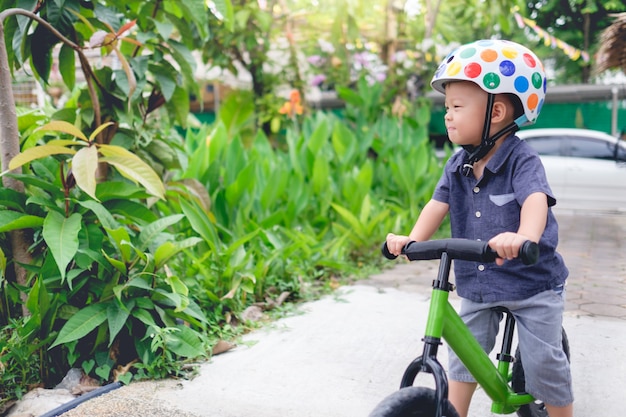 Premium Photo | Asian child riding a bicycle