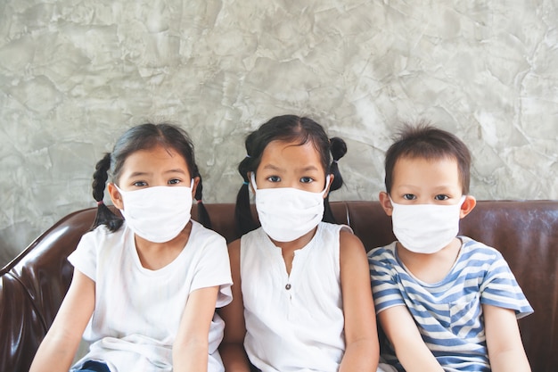 Premium Photo | Asian children boy and girls wearing protection mask stay  at home quarantine from the coronavirus covid-19 and air pollution pm2.5.