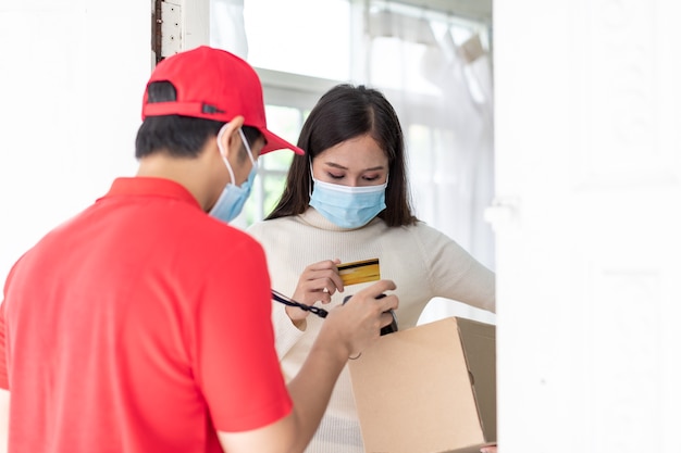 Premium Photo | Asian delivery man deliver coffee and food to young woman  customer