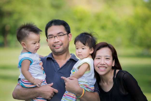 Premium Photo | Asian family relax in park in bangkok city thailand