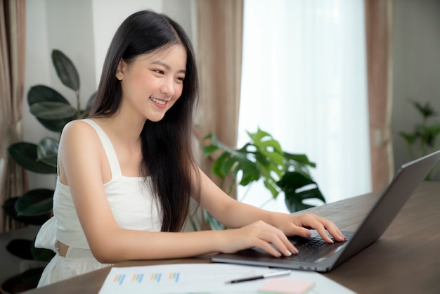 Premium Photo | Asian girl typing data to her computer notebook for prepare  her report