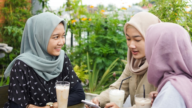 Premium Photo | Asian group hijab woman smilling in cafe with friend