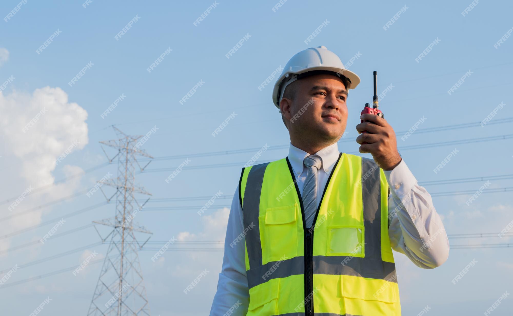 premium-photo-an-asian-male-engineer-using-a-radio-station-is-working