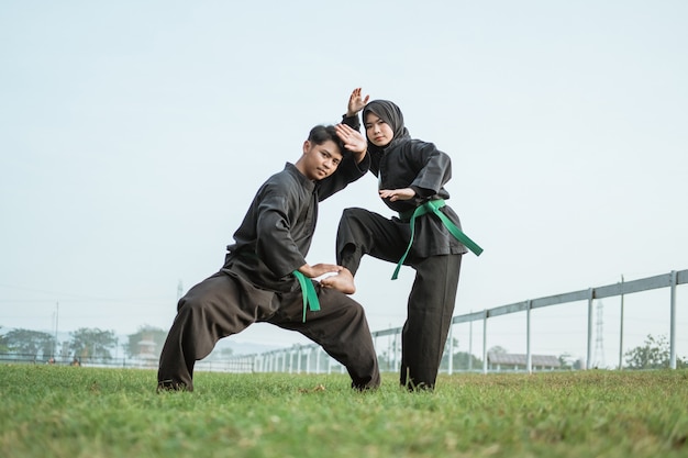 Premium Photo | Asian male fighter wearing a pencak silat uniform with ...