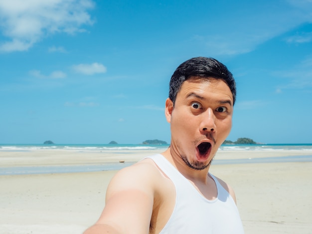 Premium Photo | Asian man on the sunny summer beach trip.