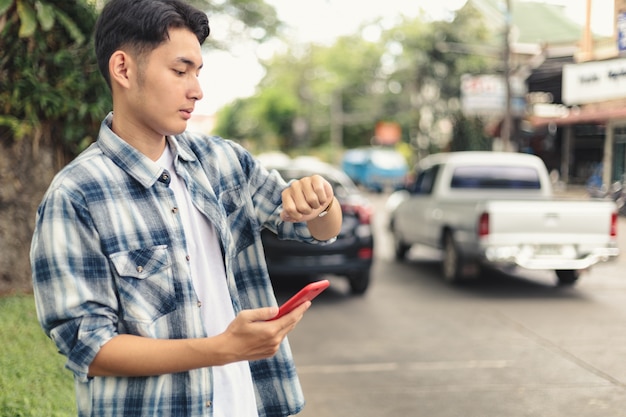 Premium Photo  Asian man waiting for uber taxi